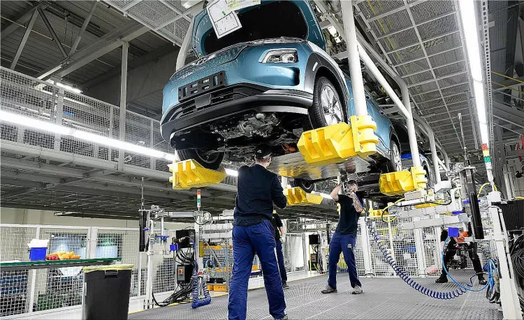 First auto factories resume production