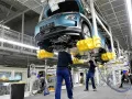 First auto factories resume production